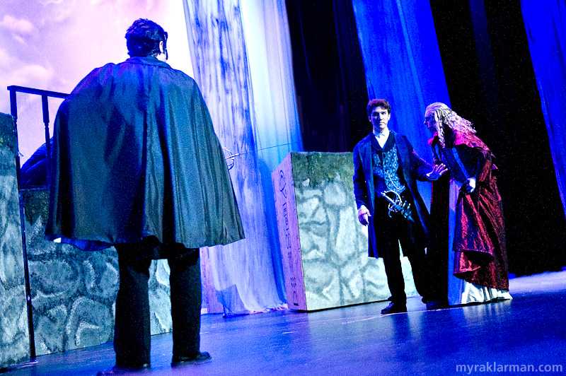 Pioneer Theatre Guild: Phantom of the Opera | Middle of Act II: The Phantom (Hank Miller) and Raoul (Ari Axelrod) moments before dueling at the graveyard. Christine (Karina Stribley) begs Raoul not to harm the Phantom, who was her “angel of music” for many years.