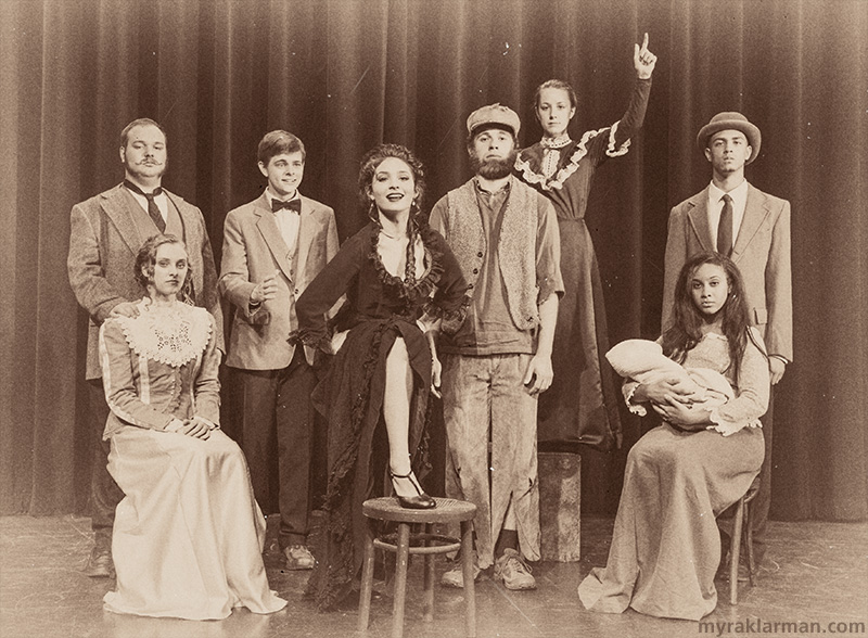 Pioneer Theatre Guild: Ragtime (Publicity Shoot) | Standing (l-r): Father (Andrew Nazzaro-Cole), Younger Brother (Jordan McKay), Evelyn Nesbit (Piper Friend), Tateh (Hank Miller), Emma Goldman (Becca Shipan), and Coalhouse Walker, Jr. (Tre Brown). Seated: Mother (Karina Stribley) and Sarah (Sina Webster).