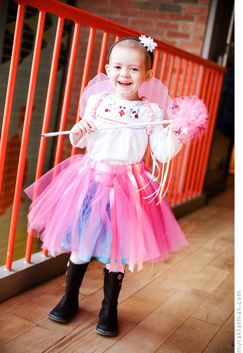 Make-A-Wish: Princess Izzy | Izzy models her fairy dress-up ensemble, which includes a skirt, wings, and wand. I love how the skirt is designed to go over her clothes.