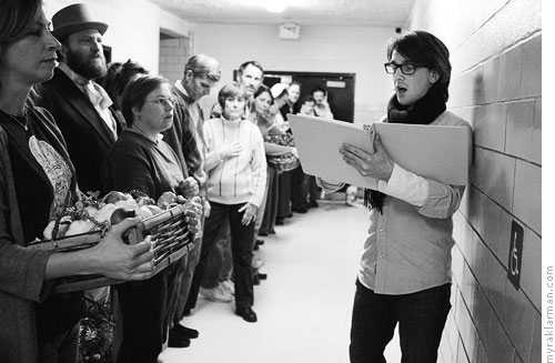 Burns Park Players: Oliver! | Assistant director Jonathan Parkey works with cast members outside the auditorium.