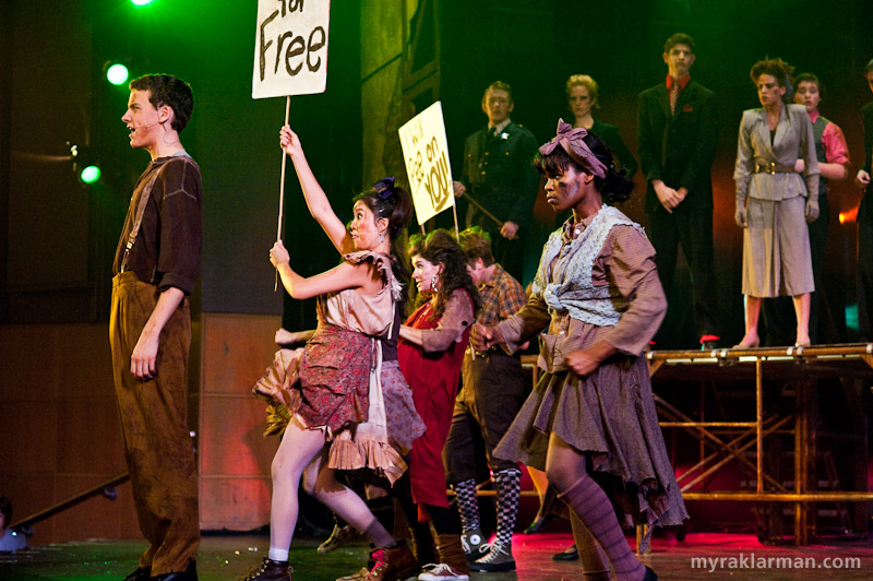 Pioneer Theatre Guild: Urinetown | Act 1 Finale brings the entire cast onto the stage. The “Pee for Free” revolutionaries throw off the shackles of economic oppression, while the forces of darkness — or so it would seem — look on from above.