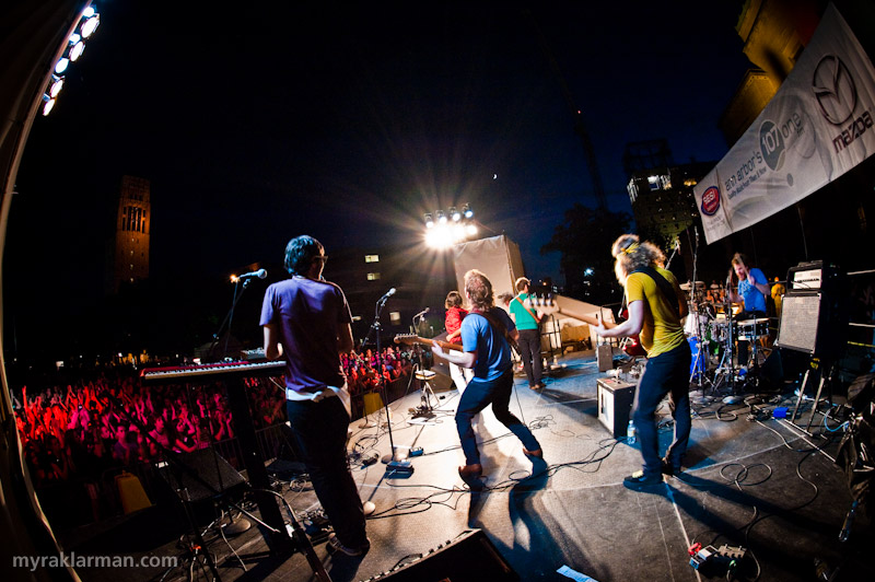 Ann Arbor Summer Festival 2009 | Mission accomplished: Got all seven members of My Dear Disco and at least several hundred of their best fans in a full-out, rockin’ shot. It wasn’t easy. The fans were quite cooperative, but a certain band member kept doing his patented “duck and cover” move (he knows who he is — nah, I’m gonna rat you out, Tyler).