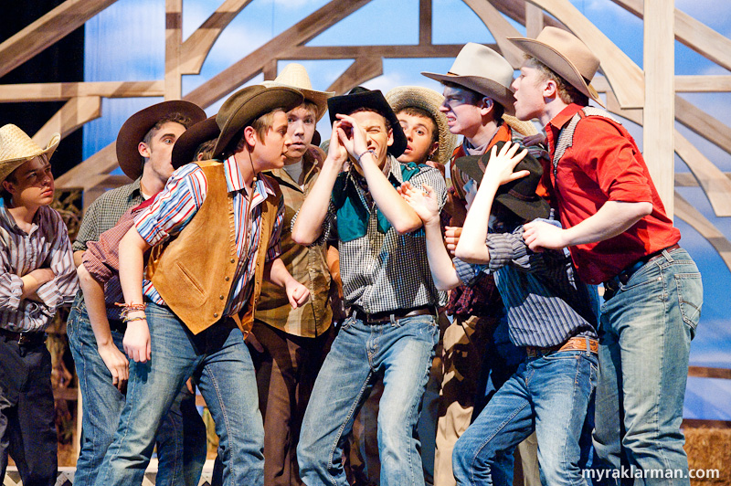 Pioneer Theatre Guild: Oklahoma! | The boys enjoy a close look at one of Will’s souvenirs from Kanses. 