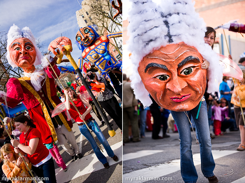 FestiFools 2010 | These papier-mâché puppets, created by U-M students Leslee Klein and Jenna Moore, take over Main St. | U-M student Joy Lerner helps us appreciate the scale of Rococo Man’s head.