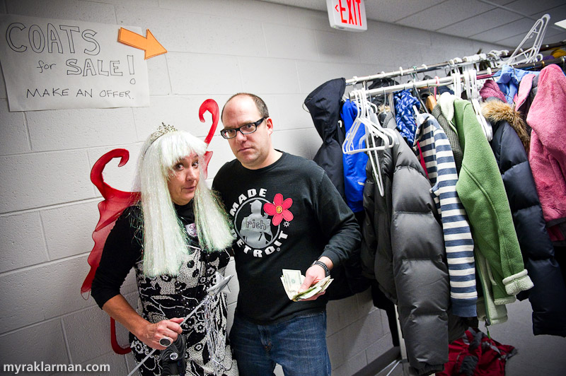 Marching towards FoolMoon + FestiFools 2011 | Shary Brown and Rico man the coatrack at Puppets + Pancakes. In a perfect world, FestiFools wouldn’t steal its studio visitors’ coats and then fence them at pennies on the dollar, but a cash-strapped arts organization has gotta do what it’s gotta do. I wonder if there might not be a better way for FestiFools to raise funds…