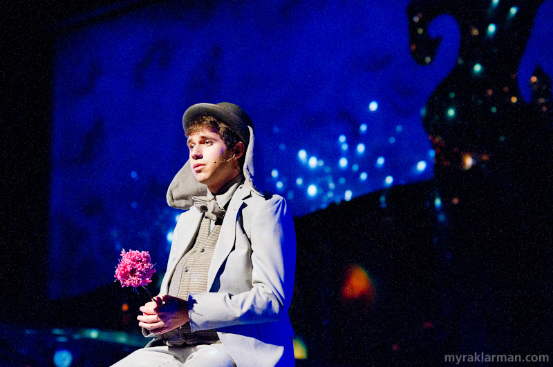 Pioneer Theatre Guild: Seussical | Ostracized by all the other animals for his devotion to a speck, Horton (Hank Miller) feels “Alone in the Universe.” The lighting effectively isolates Horton within a vast darkness.